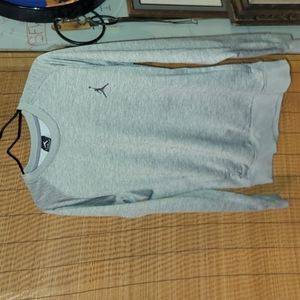 Jordan. Pullover with two front hoodie-style pockets. Size Large.